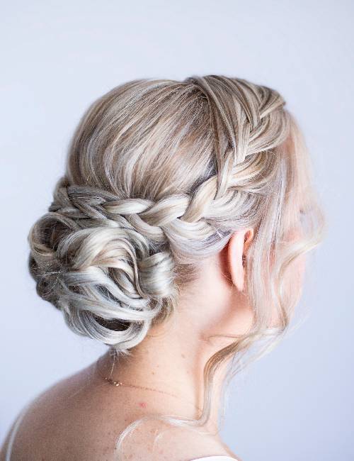 Photo of Open hairstyle with braided band and waves for engagement