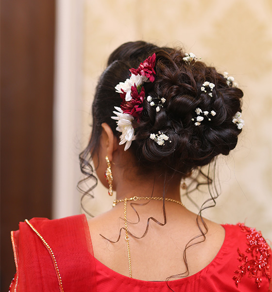 Image of Indian Woman With Hair Bun And Flowers-XJ291459-Picxy