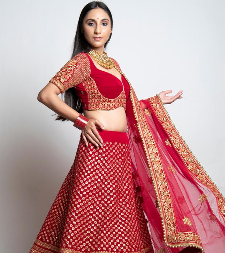 Photo of Offbeat bridal lehenga and groom in red