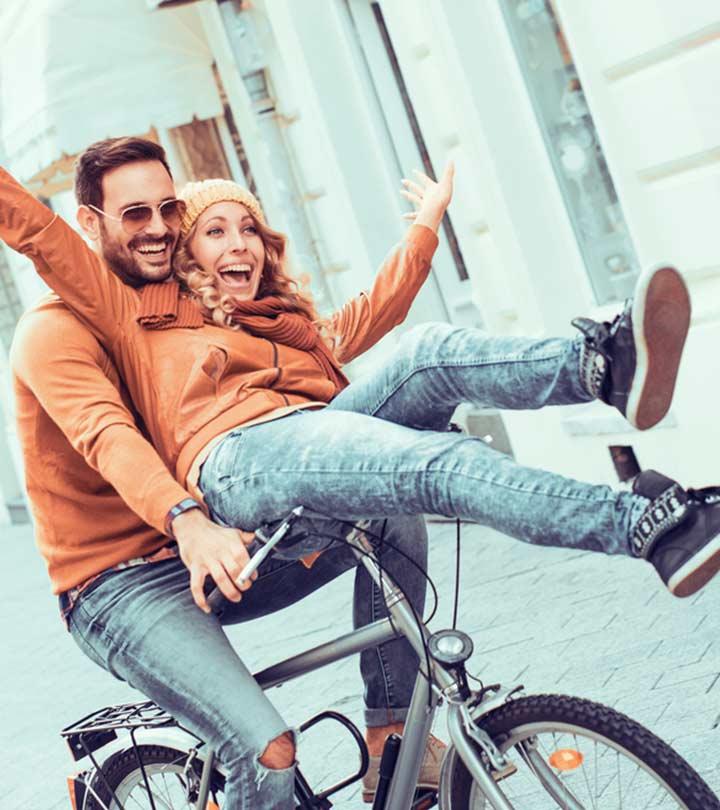 A couple riding a bicycle