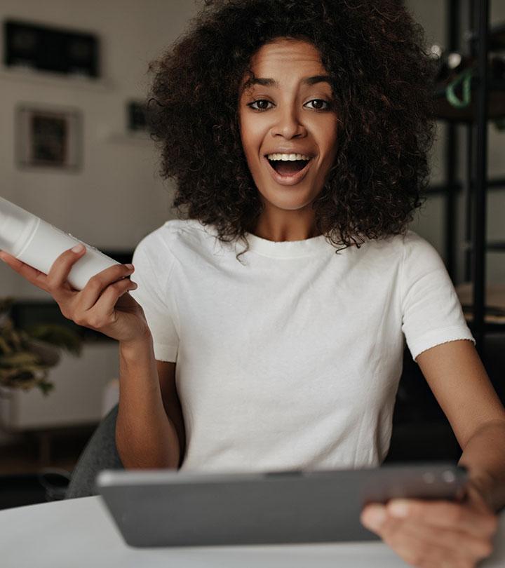 A girl holds a tab and a skincare product A girl holds a tab and a skincare product