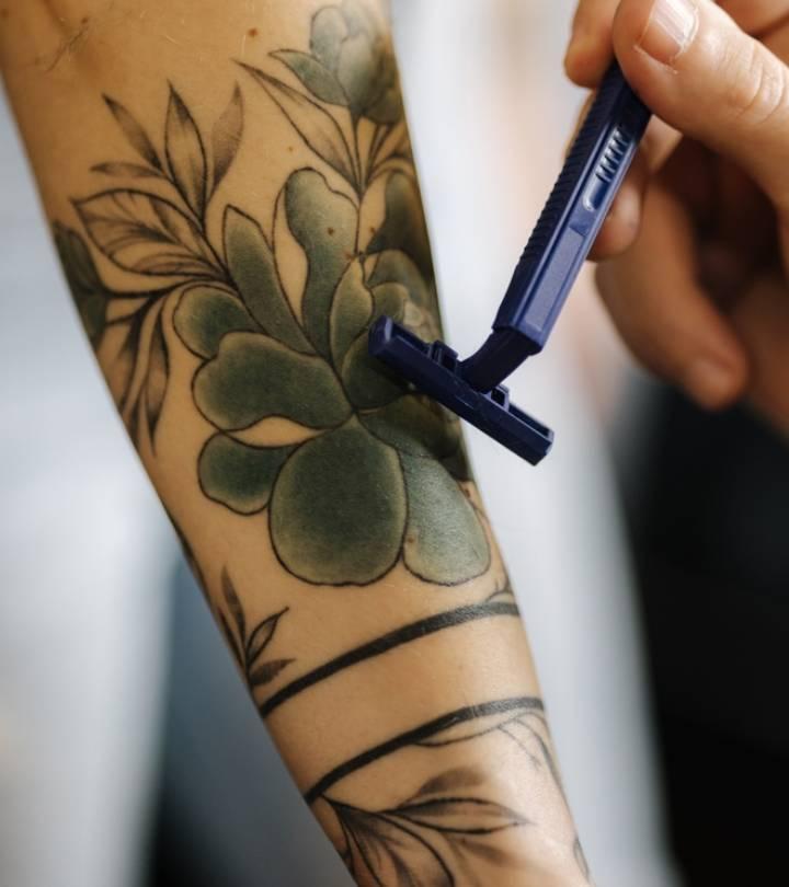 Smiling Tattoo Artist Shaving Mans Hand Before Tattooing High-Res Stock  Photo - Getty Images