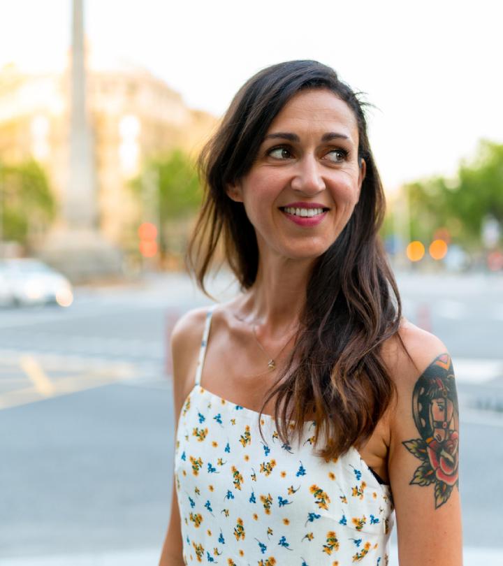 A tattooed woman traveler