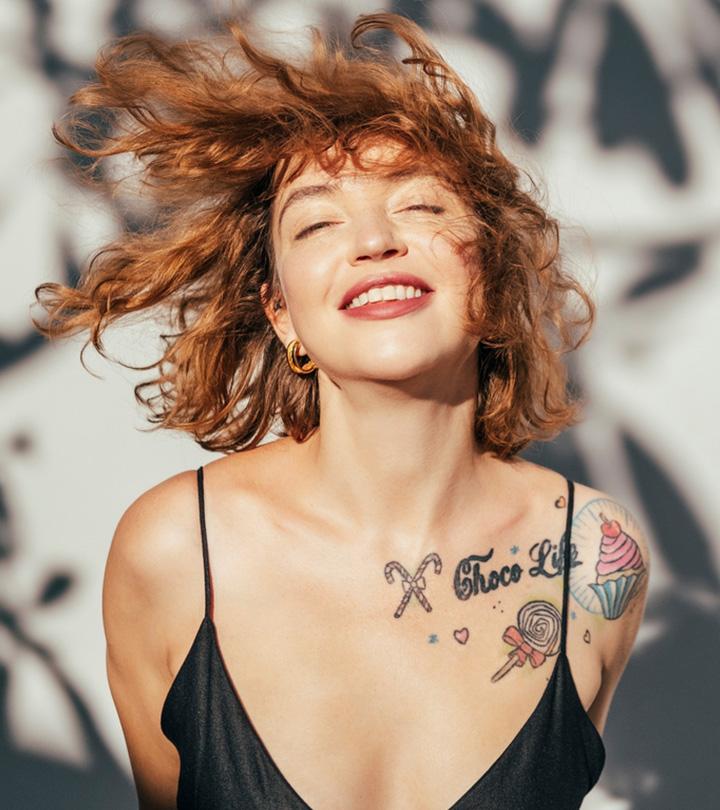 A woman flaunts her healed tattoos in the sun