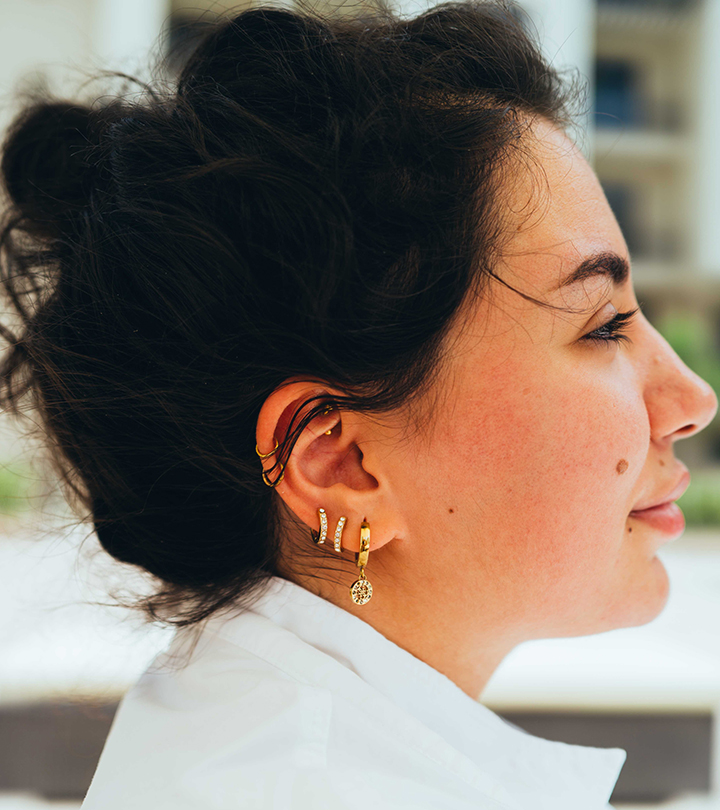 A woman with multiple ear piercings