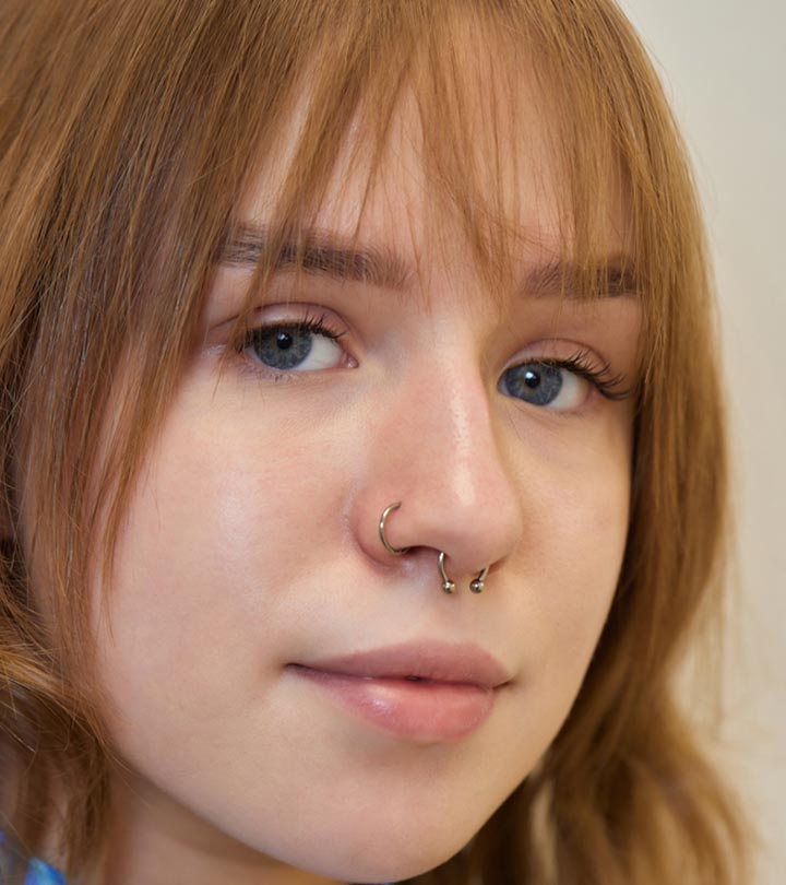 A young woman with a nose piercing