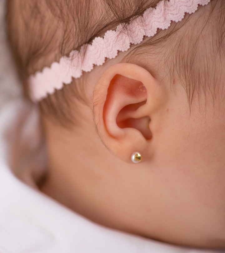A baby with a pierced ear