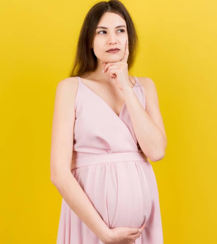 Pregnant woman thinking before getting a piercing