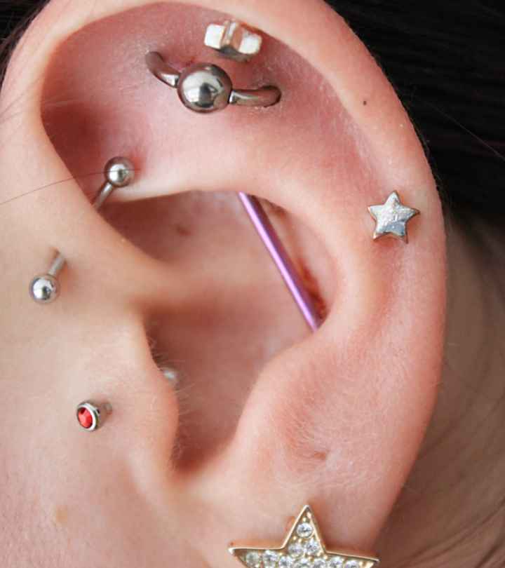 Close-up of multiple piercings on the ear