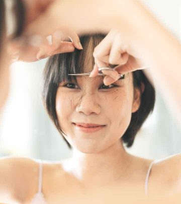 A woman cutting face-framing layers