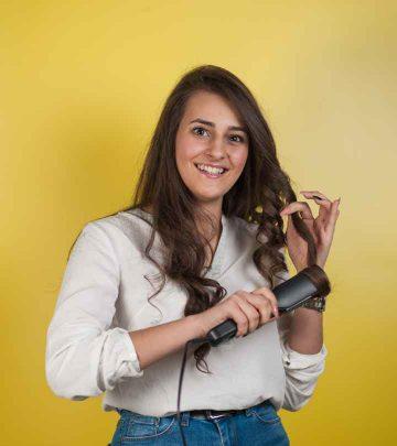 A woman getting her hair curled with a flat iron