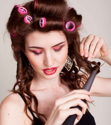 A woman using hot rollers and a curling iron