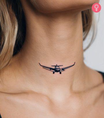 Woman with an airplane tattoo on her neck