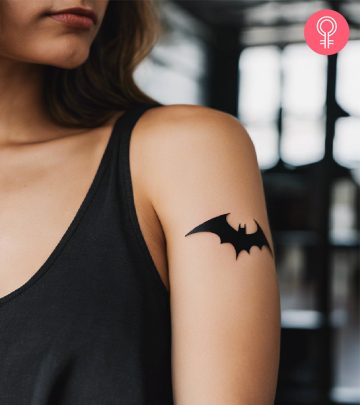 Batman tattoo on the upper arm of a woman