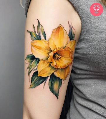 Watercolor daffodil tattoo on the arm