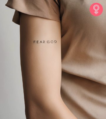 A woman with a fear god tattoo on her arm