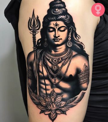 A woman with a Shiva tattoo design on her forearm