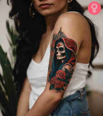 A Santa Muerte tattoo design on the arm of a woman