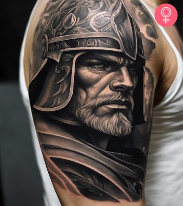 A man with a warrior tattoo on his arm