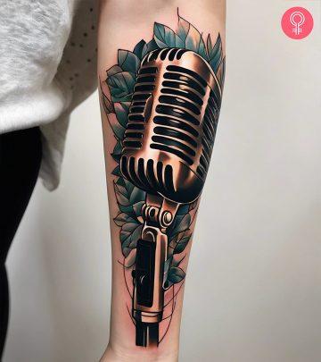 A microphone tattoo on the forearm