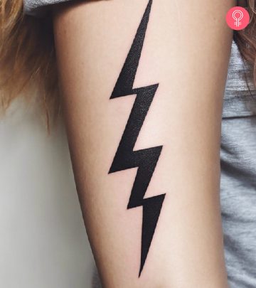 A woman with a lightning bolt tattoo on her arm