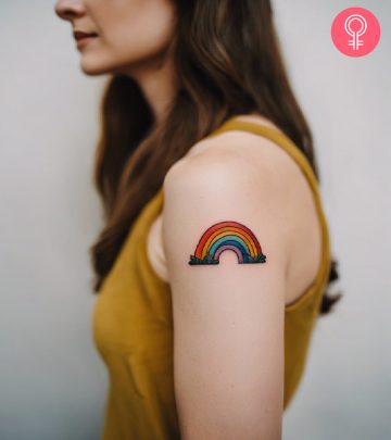 A woman with a rainbow tattoo on her arm