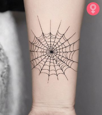 A woman with a spider web tattoo design
