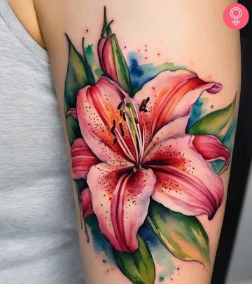 A woman with a stargazer lily tattoo