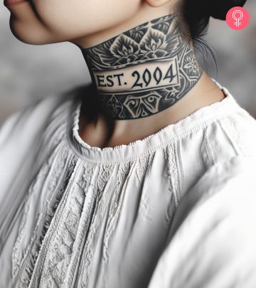 A woman with an Est. 2004 tattoo on her back shoulder