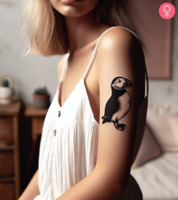Puffin tattoo on a woman’s arm Puffin tattoo on a woman’s arm