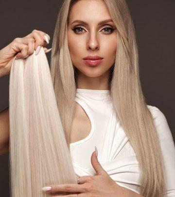 A woman with blonde hair and blonde hair weave extensions in her hand. A woman with blonde hair and blonde hair weave extensions in her hand.