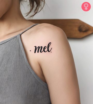 A cute baby name tattoo on the front shoulder