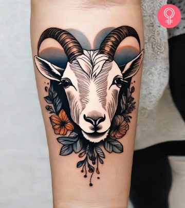 Woman with Capricorn tattoo on her upper arm