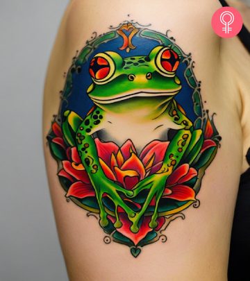 A vibrant frog tattoo on the upper arm of a woman