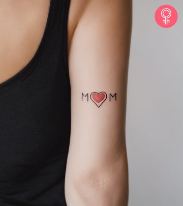 A woman sporting a mom heart tattoo