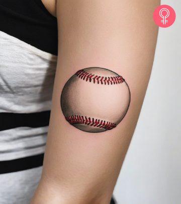 A woman with a baseball tattoo