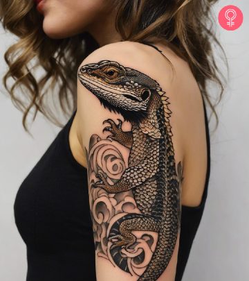 woman with a bearded dragon tattoo on her arm.