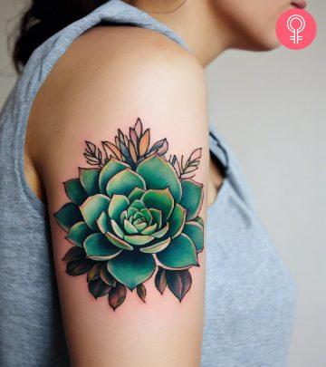 woman with succulent tattoo on her upper arm woman with succulent tattoo on her upper arm