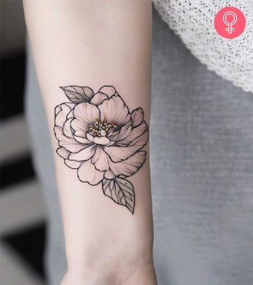 An outlined peony tattoo on the forearm An outlined peony tattoo on the forearm
