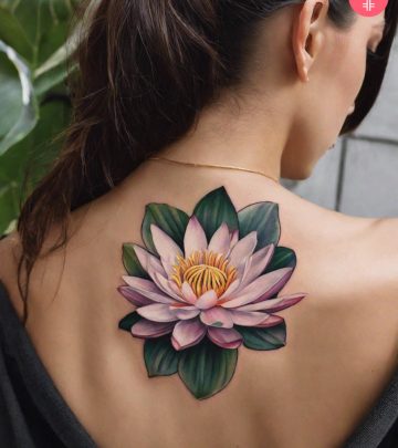 A woman wearing water lily flower tattoo on the back