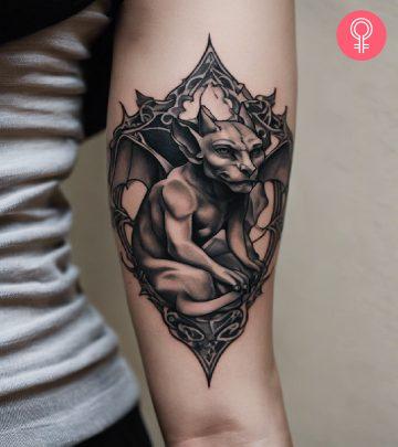 A gargoyle tattoo design on the arm of a woman A gargoyle tattoo design on the arm of a woman