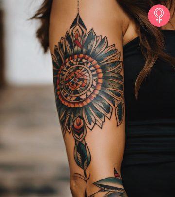 A Native American tattoo on the arm of a woman A Native American tattoo on the arm of a woman