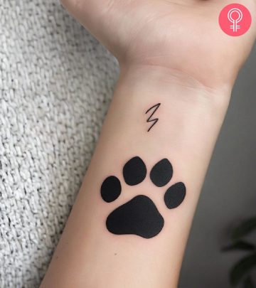 A paw print tattoo on the wrist