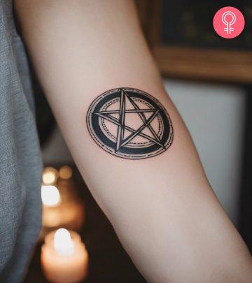 A pentagram tattoo on the arm