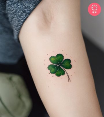 A woman sporting a four-leaf clover tattoo