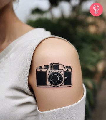 A camera tattoo on the arm