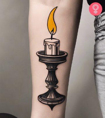 A candle tattoo on the arm A candle tattoo on the arm