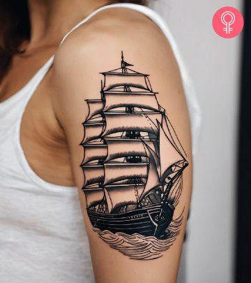 A ship tattoo on the upper arm A ship tattoo on the upper arm