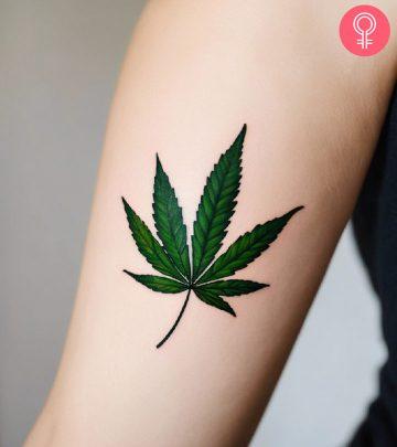A weed tattoo design on the arm of a woman A weed tattoo design on the arm of a woman