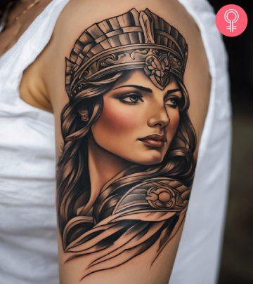 A woman with an Athena tattoo A woman with an Athena tattoo